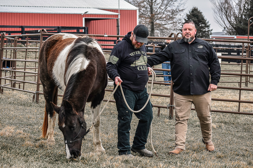 Kentucky Army combat veteran Jeremy Harrell (right) founded Veteran’s Club, based in the Louisville area, and advocates for mental health through a variety of organizations. Among other programs, The Veteran's Club runs an Equine Facilitated Mentoring program to help veterans with PTSD and traumatic brain injuries. Pictured: Harrell with Don Hoy, USMC Veteran.